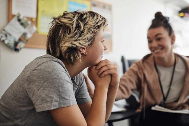 Behavioral counselor talking to teen